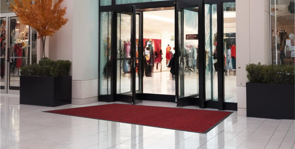 Red Ultimats entrance mat at a shopping mall doorway