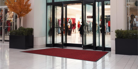 Red Ultimats entrance mat at a shopping mall doorway