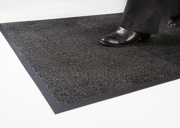 UltiDure PA mat grey with nitrile rubber back and borders man walking over the mat by Ultimats